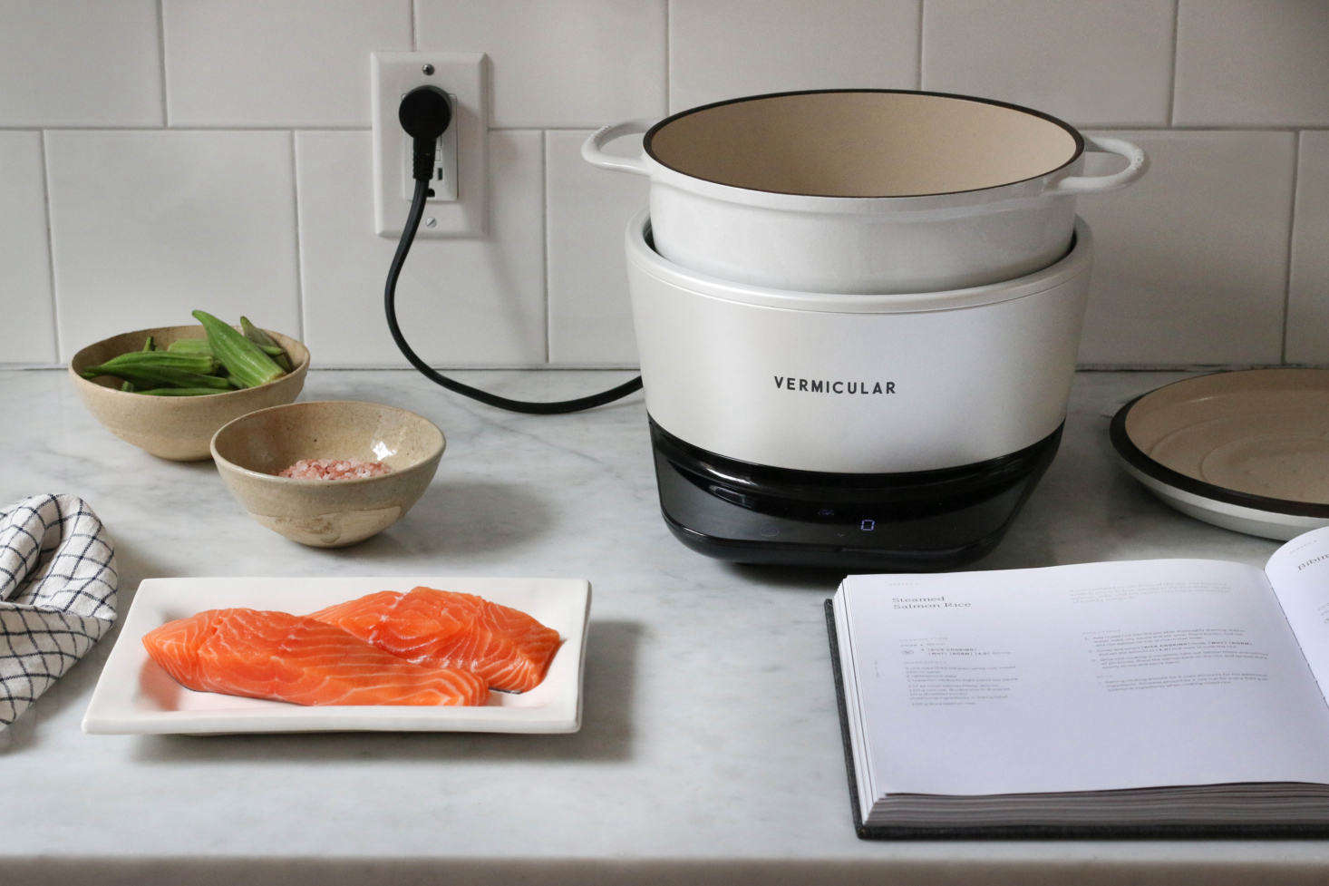 The final step: Place the salmon fillets on top of the uncooked rice, then add