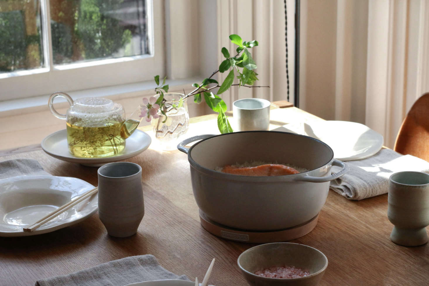 The Vermicular enameled cast iron pot can go straight to the table using the wood Magnetic Trivet, which attaches via magnet to the base of the pot, creating an instant (and attractive) heat barrier.