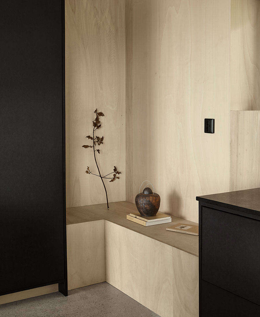 Pine plywood benches blend seamlessly into the walls.