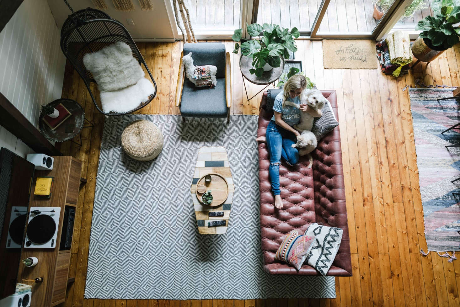 “Looking down at the living space from the loft you see different seating options, the TV, the record player, and the audio system—everything you need.”